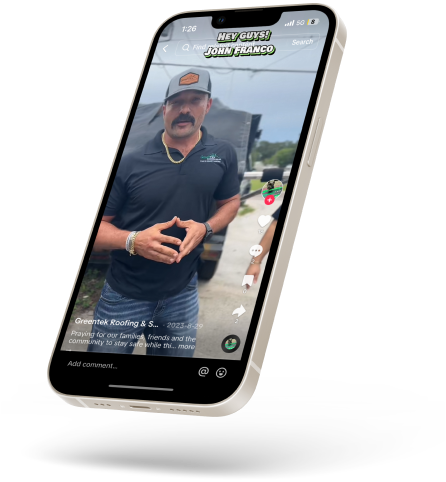 A smartphone displays a social media video of a man with a mustache and cap, standing outside and speaking to the camera with his hands together, wearing a black shirt and blue jeans, sharing expert tips on roofing Tampa homeowners can trust.