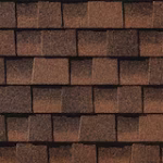 Close-up view of brown asphalt roof shingles arranged in a staggered pattern, showing texture and overlapping layers.