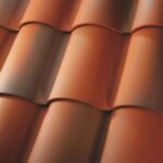 Close-up view of overlapping curved orange roof tiles, arranged in neat, horizontal rows. The tiles have a smooth surface with a glossy finish, reflecting natural light.
