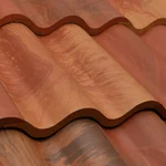 Close-up of overlapping terracotta roof tiles with a wavy, corrugated pattern in various shades of red, orange, and brown.