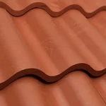 Close-up of red, wavy ceramic roof tiles arranged in overlapping rows, showing their smooth texture and undulating pattern.