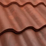 Close-up of red, wavy, metal roof tiles arranged in overlapping rows, creating a rippled pattern.
