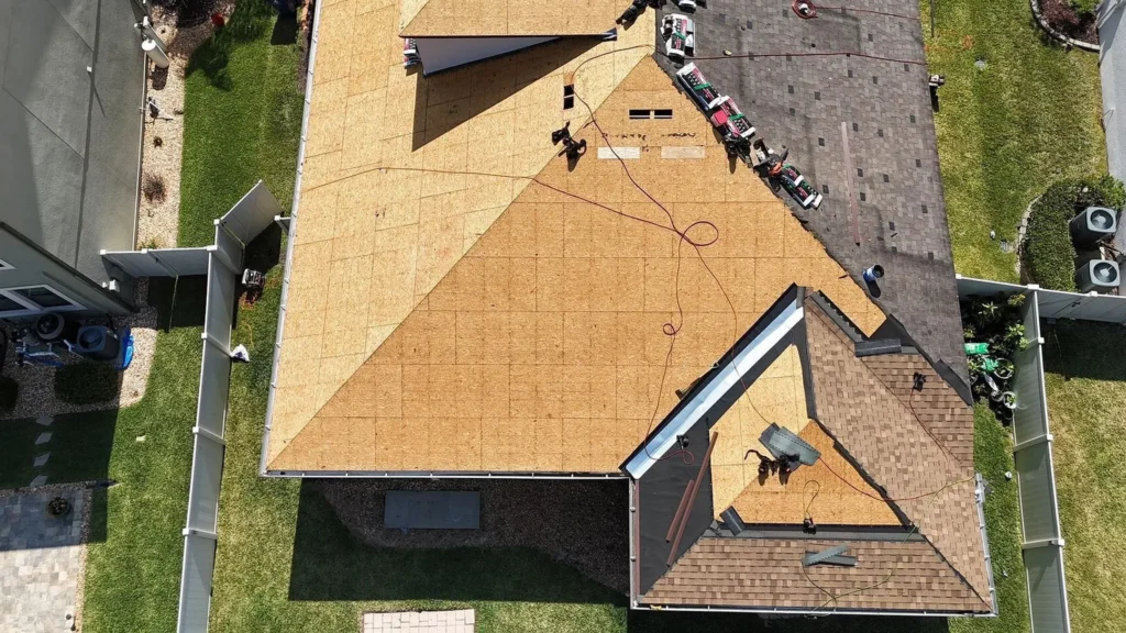 Roofing team working on home roof.